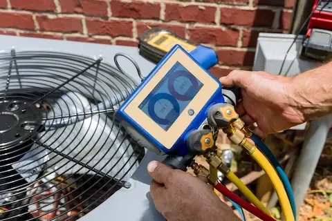 Professional checking air conditioner pressure gauges for Woodburn HVAC