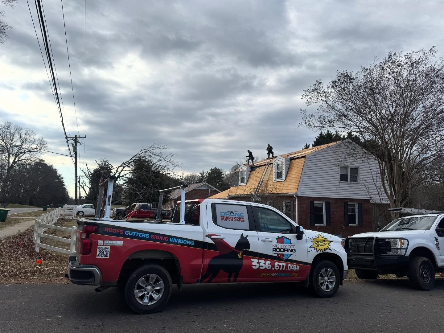 The roof of a building with a tree in the background