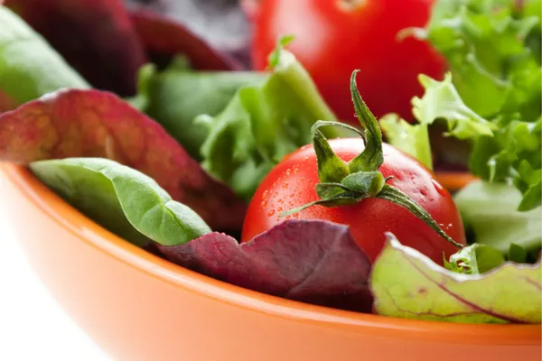 What is the secret to having tomatoes in my fall salad garden?