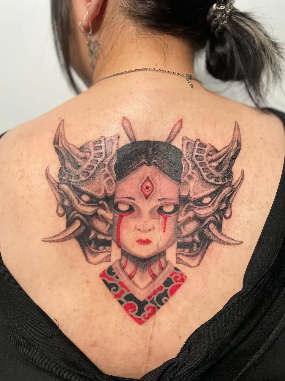 person in blue denim shorts and white nike sneakers standing on gray concrete floor