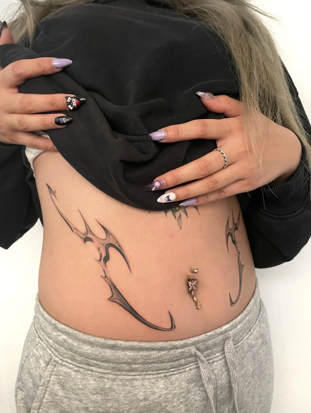 person with tattoo on right arm