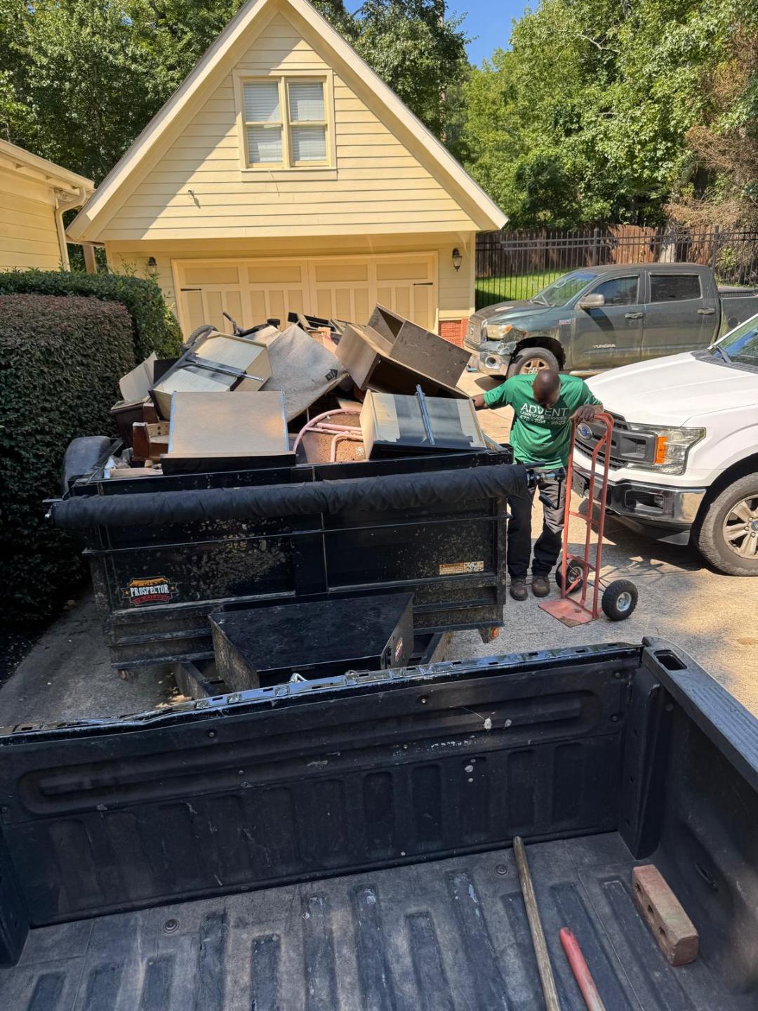 a bench sitting in the middle of a lush green park