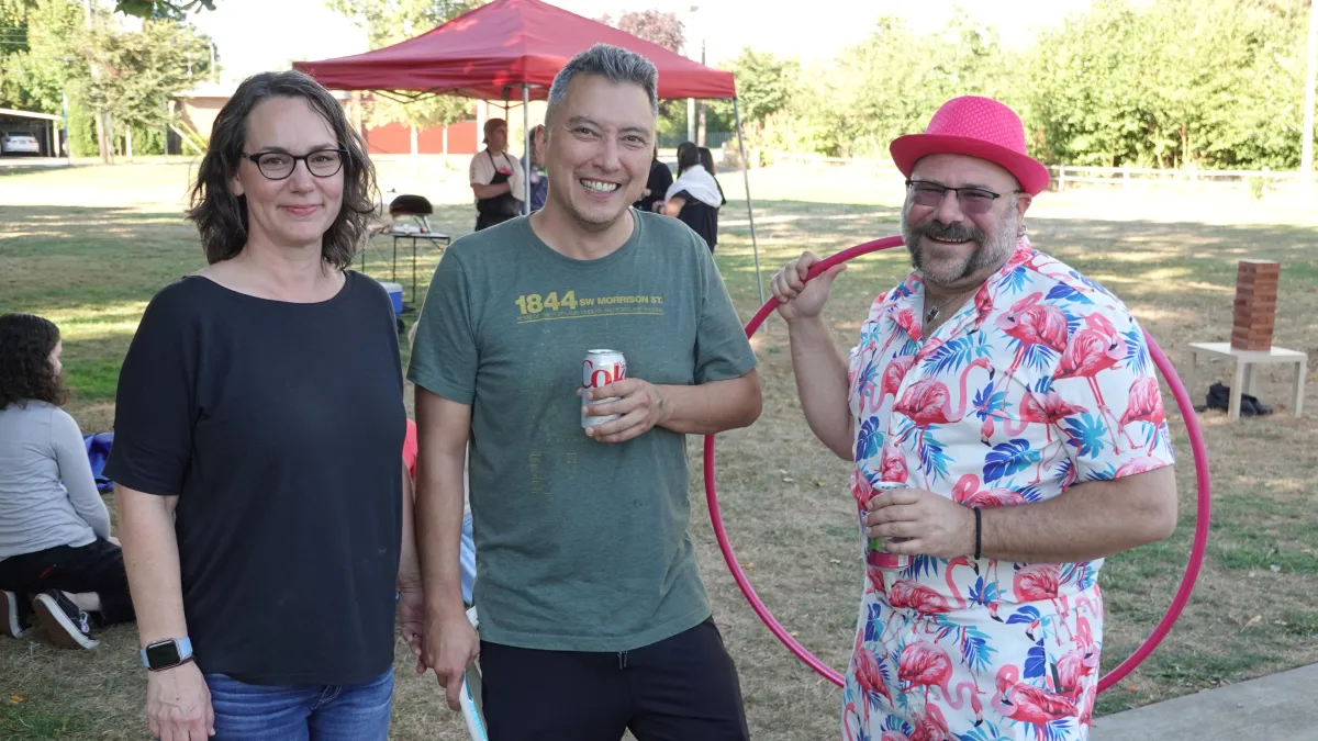 man in blue long sleeve shirt holding smartphone