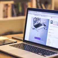 Image of a laptop open showing a website