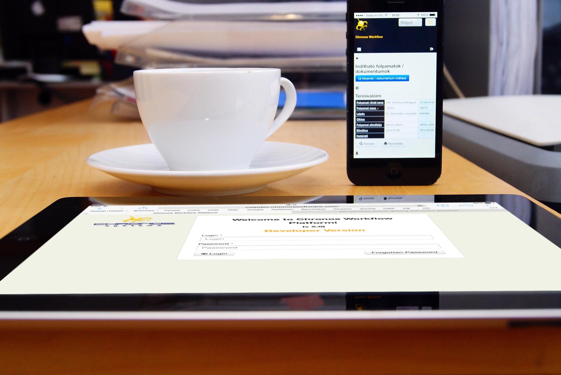 Image of coffee cup next to ipad