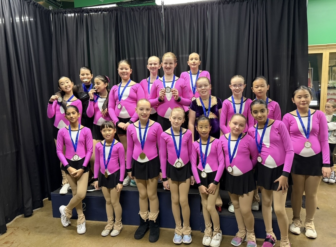 Young skaters smiling together on the ice
