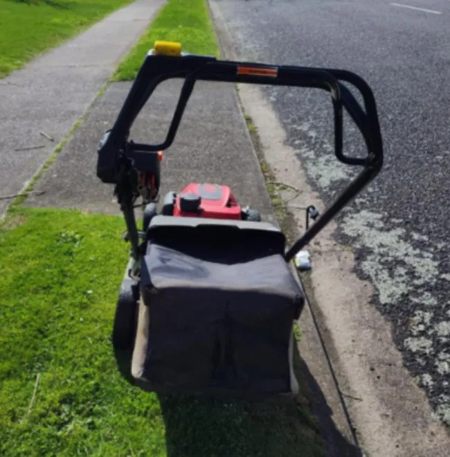 mowing next to concrete patch