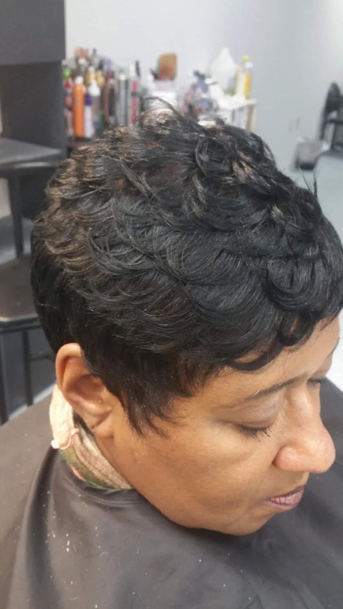 a woman's head on a white surface