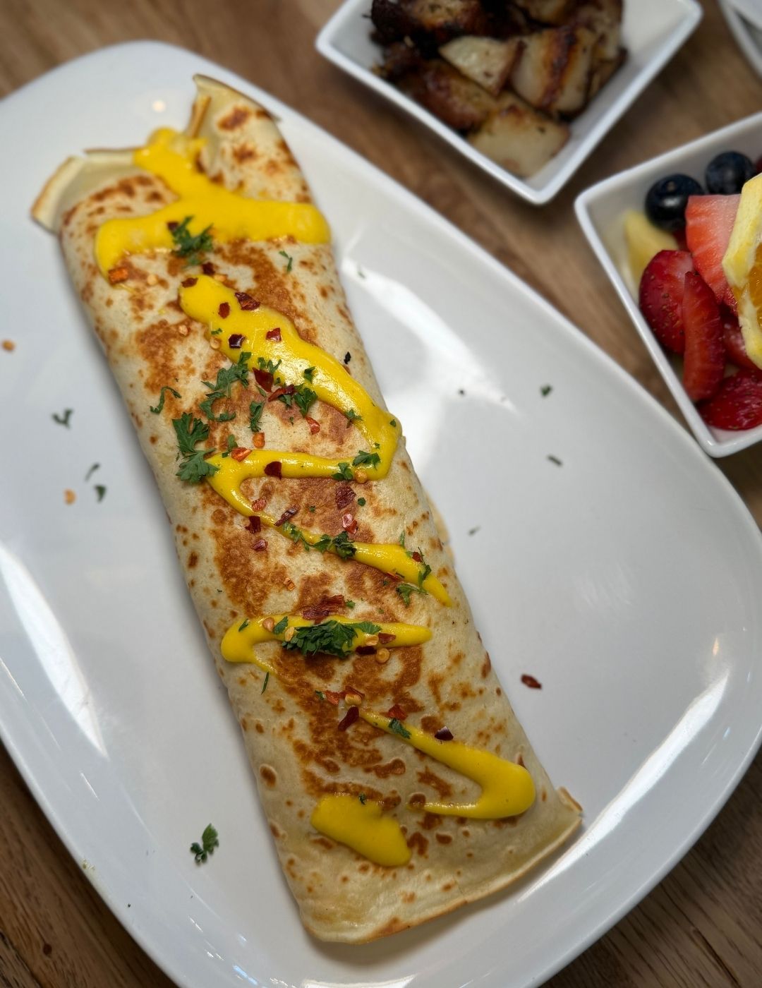 An elongated white plate with a savory appetizer