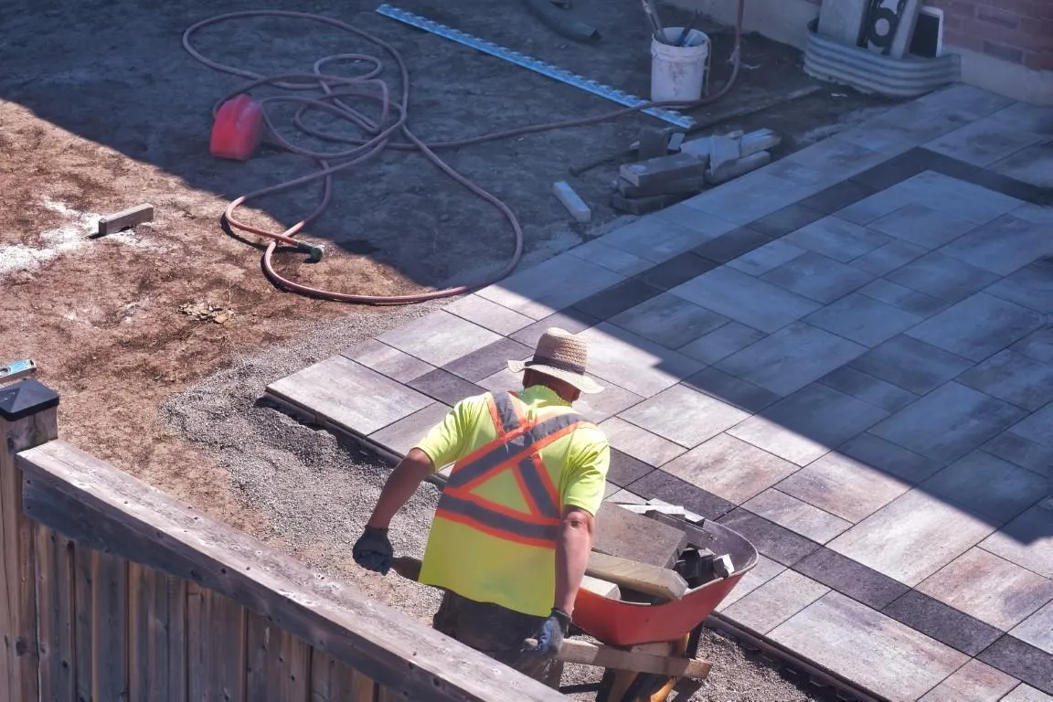 Completing an outdoor paver patio installation Coral Springs, FL 