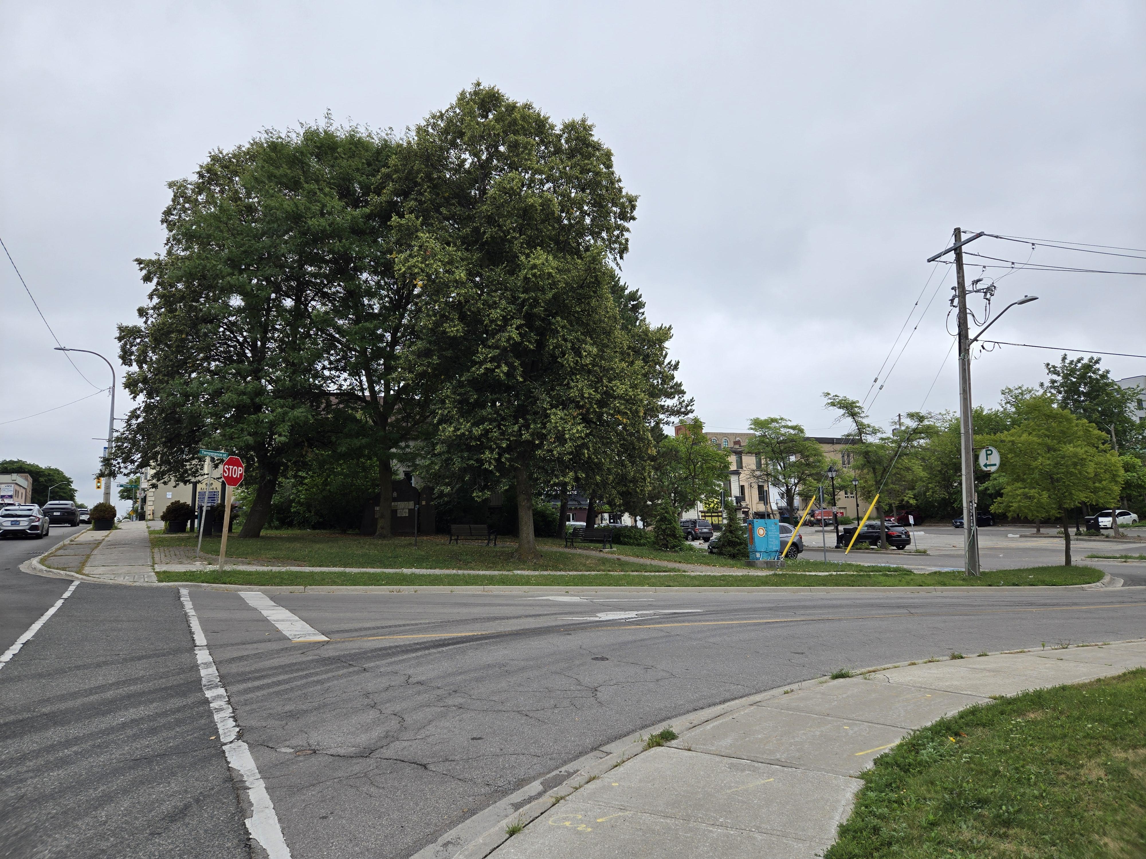 The parking lot behind Club X Indoor Golf at a distance from the corner of Temperance Street and Wellington Street West.