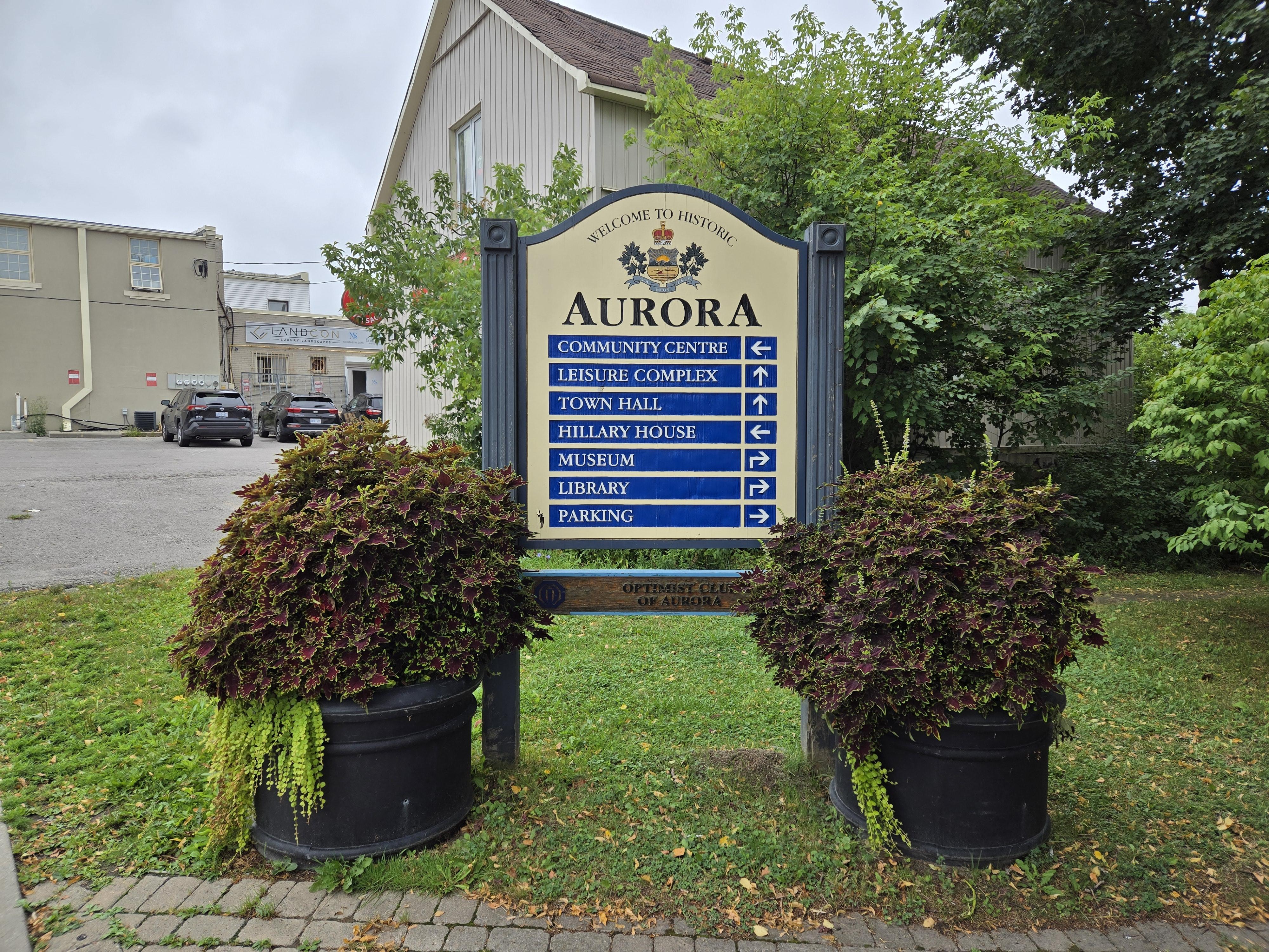 A "Historic Aurora" signboard with directions to various landmarks.
