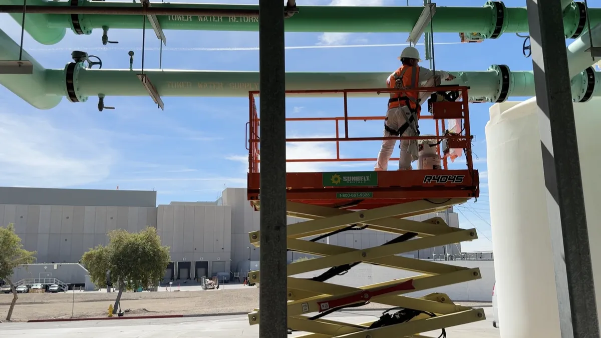 Expert industrial pipe coatings by DL Coatings: MEWP scissor lift certified, power wash prep, safety harness, and corrosion protection.