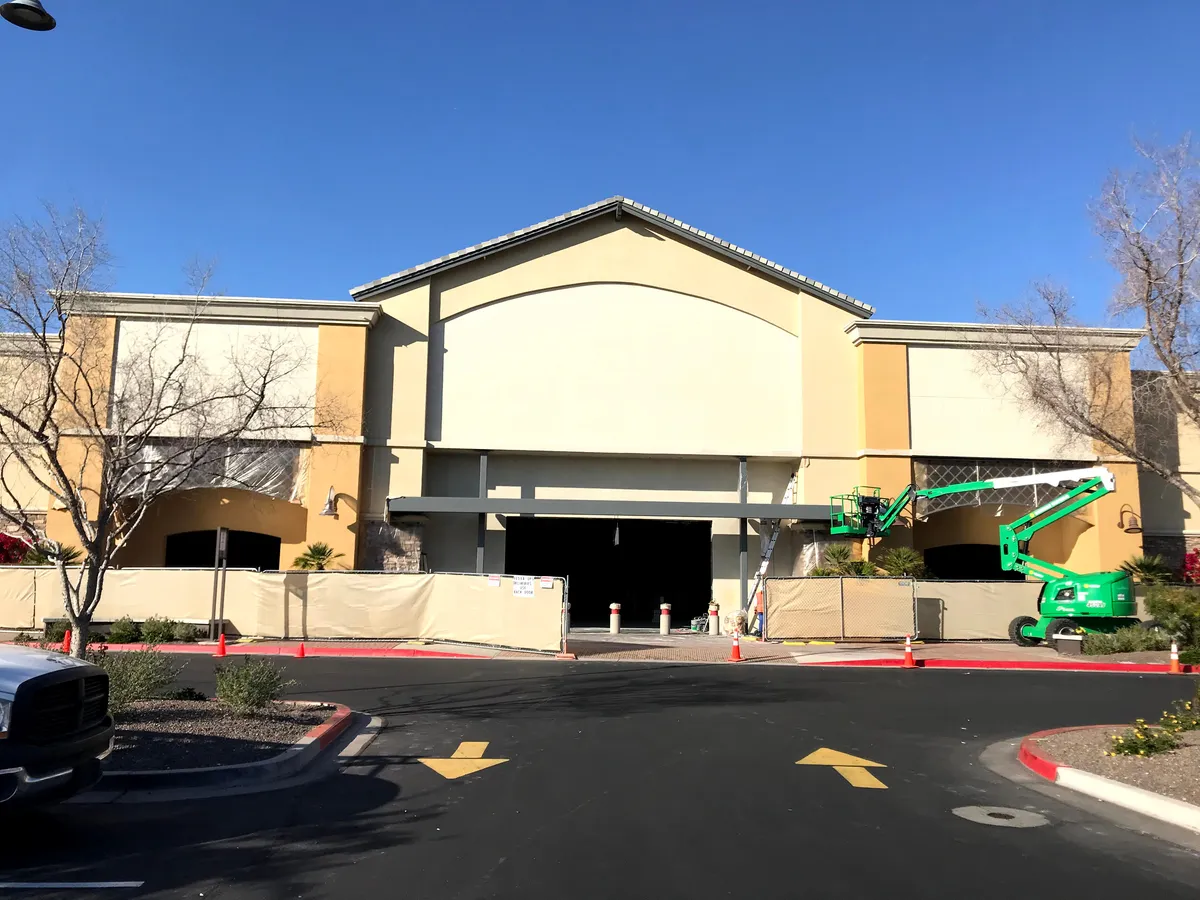 Bob’s Furniture retail facade painting: DL Coatings completes exterior spray and back-roll acrylic coating under one week using MEWP boom lifts.