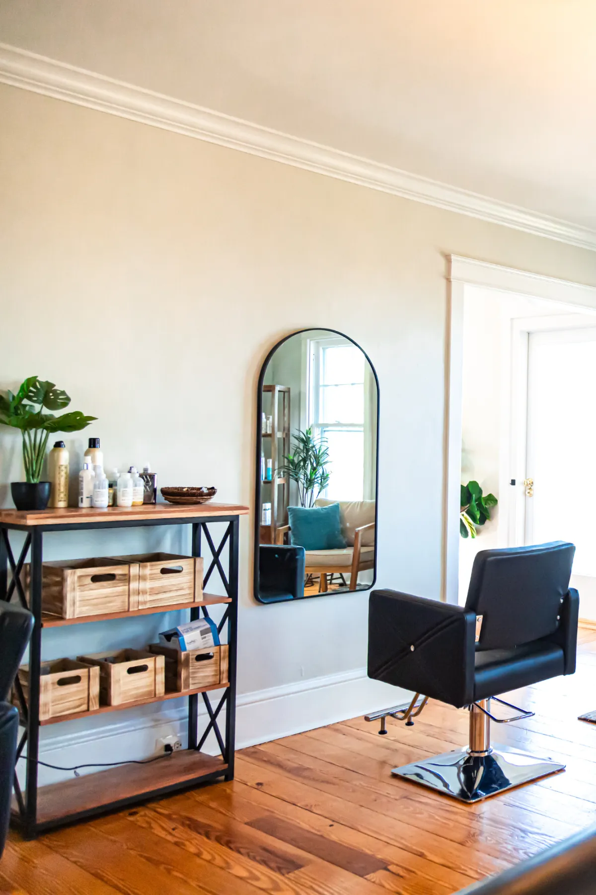 Blond woman getting hair cut at Zoe Zimmerman's  hair salon