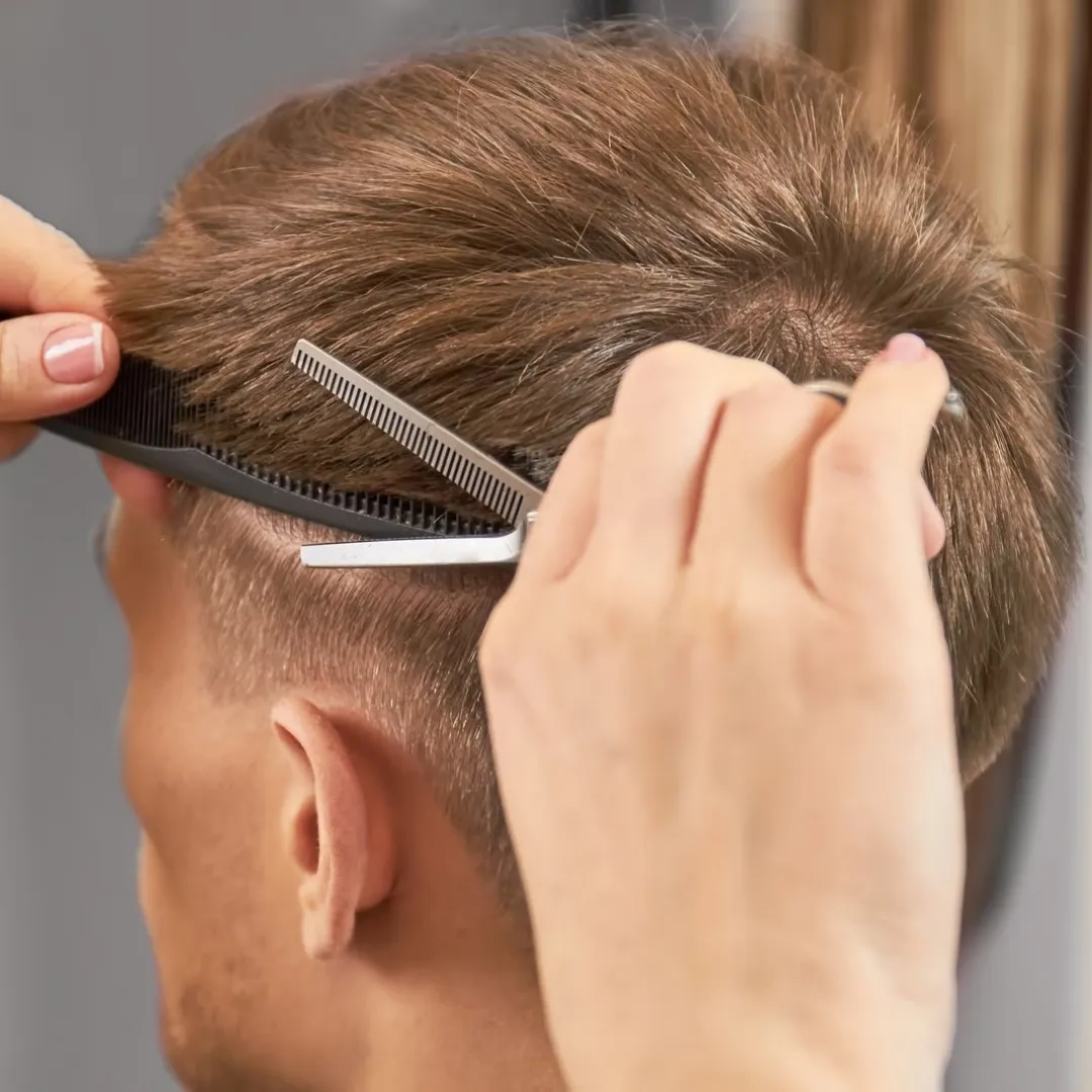 Side view of a man with a clean fade haircut