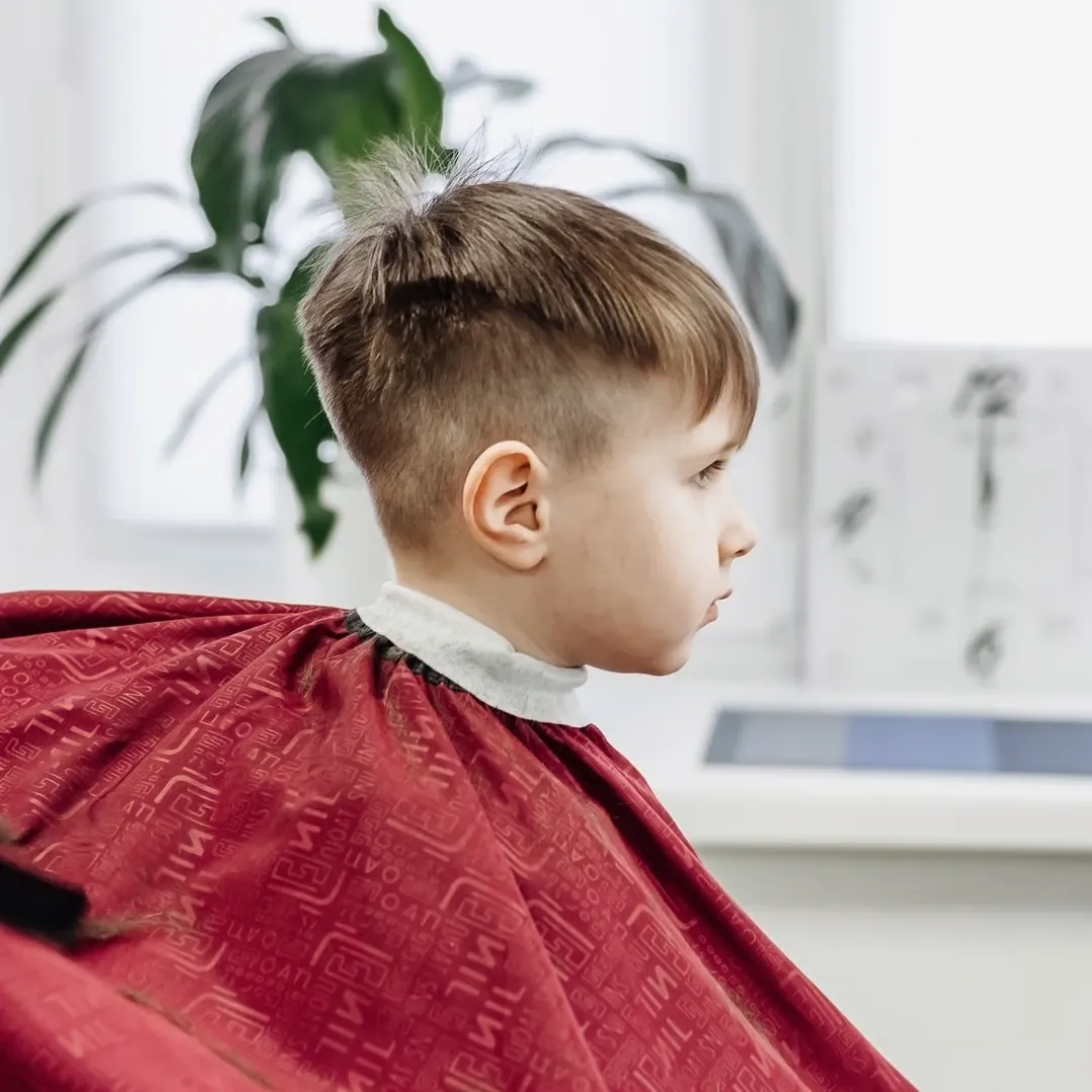Side view of a man with a clean fade haircut