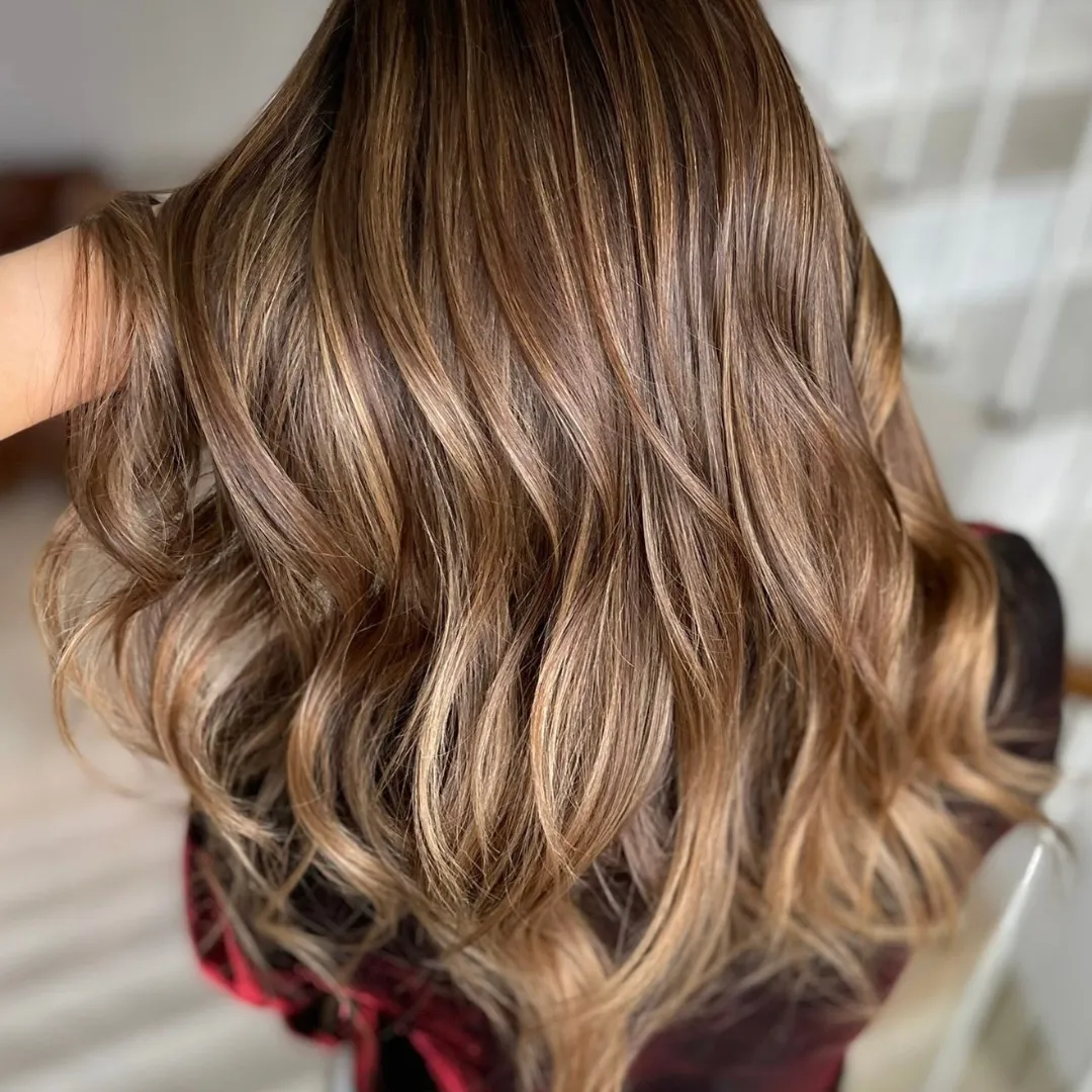 Warm caramel balayage on brown hair