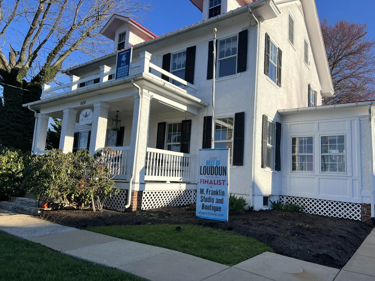 Salon location with award-winning finalist sign out front