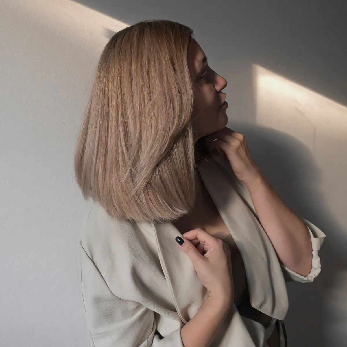 Blond woman getting hair cut at Zoe Zimmerman's  hair salon