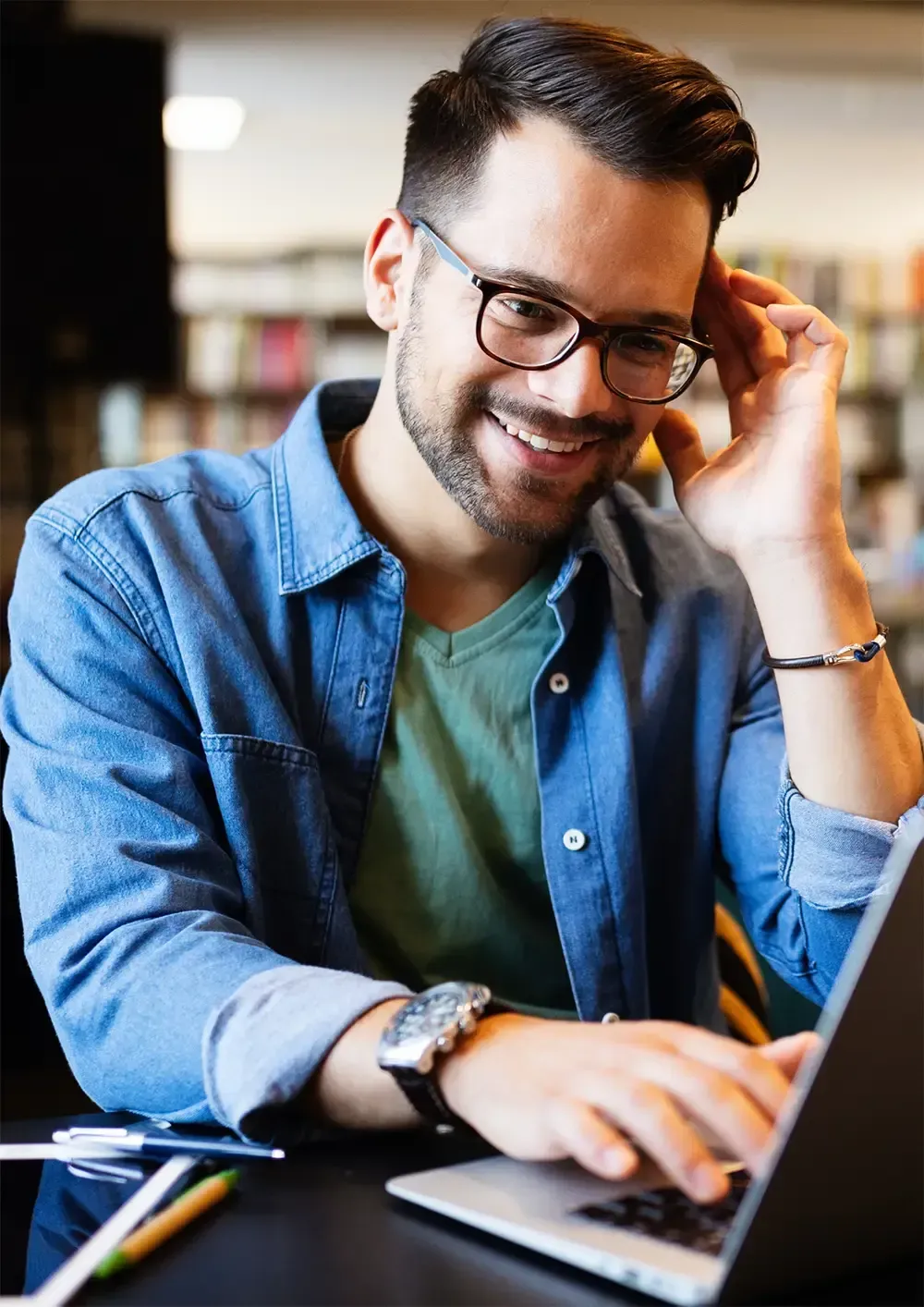 Male business owner taking an online course in small business
