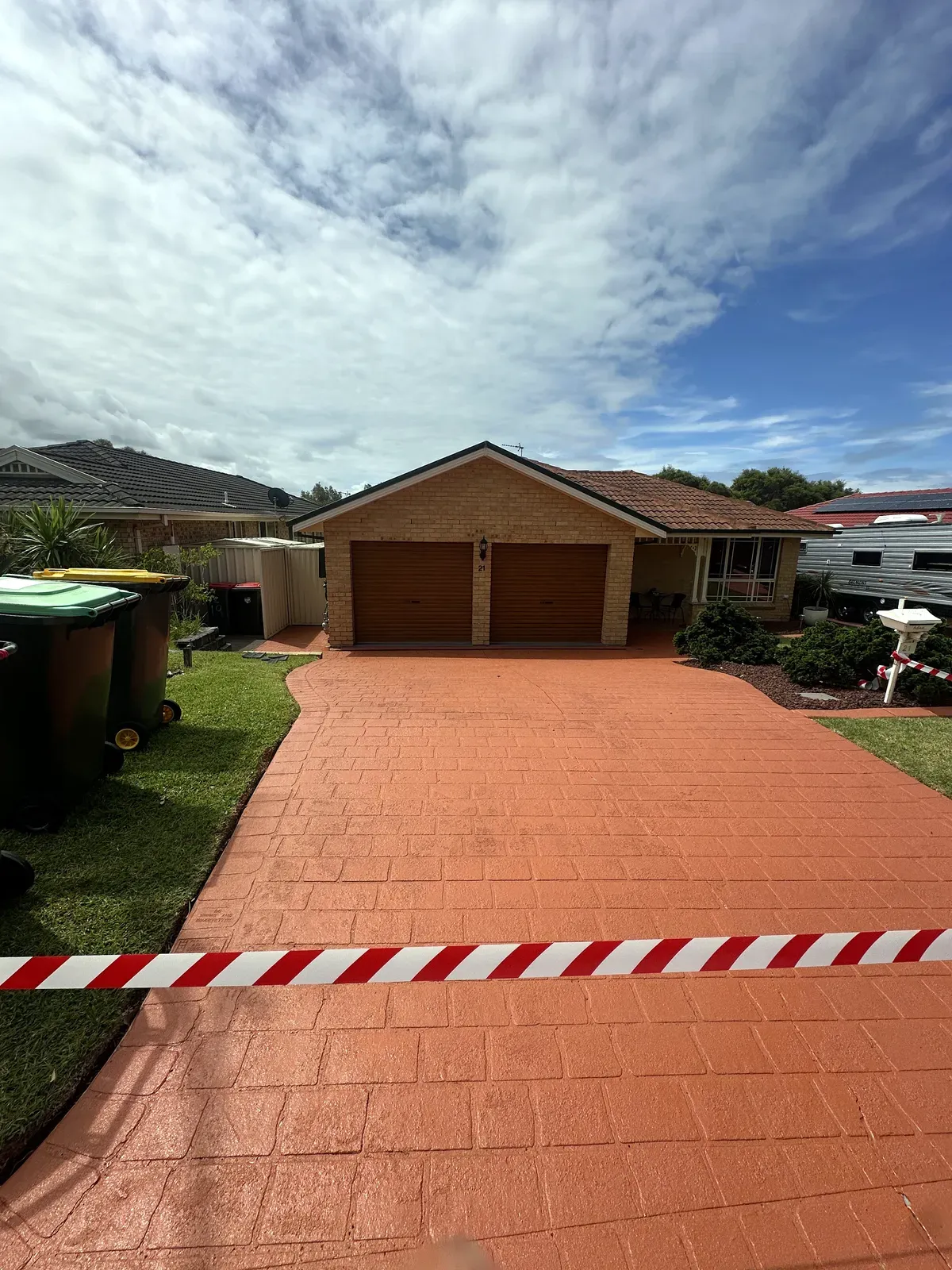 Driveway cleaned and colour sealed