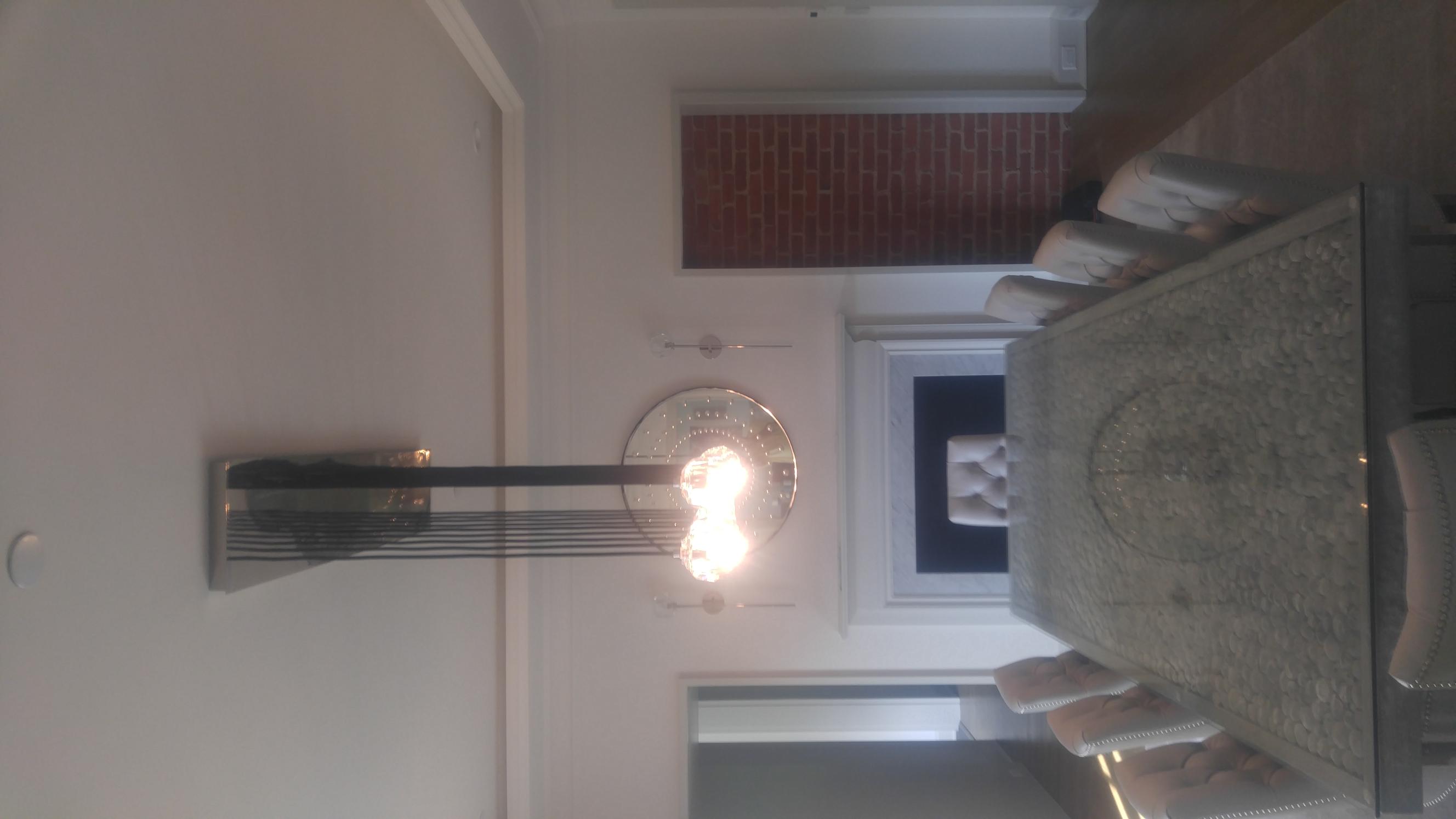 modern dining room chandelier installation above table Westchester NY