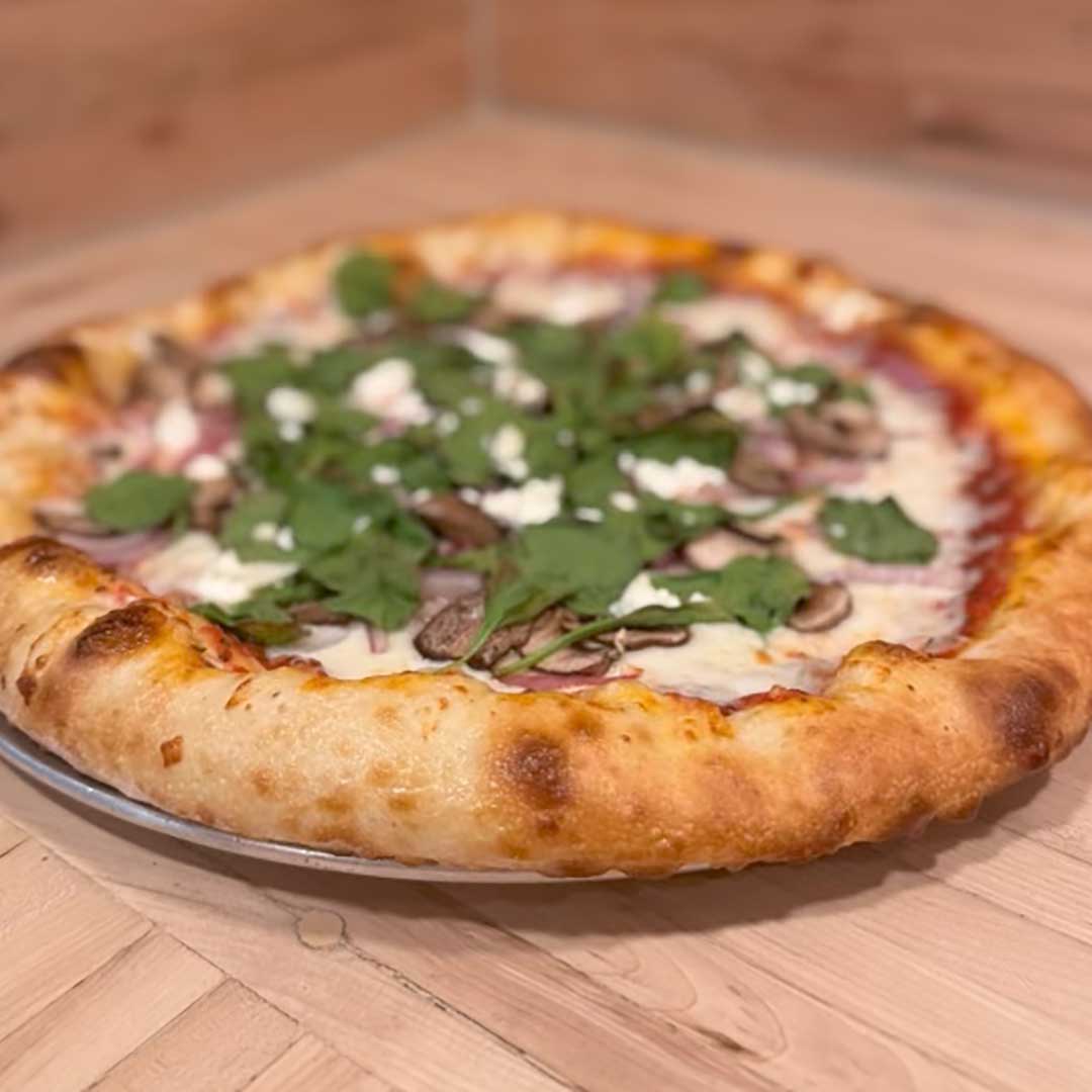 Farmers Market Pizza with spinach, mushrooms, onions, goat cheese at Pantaleone’s