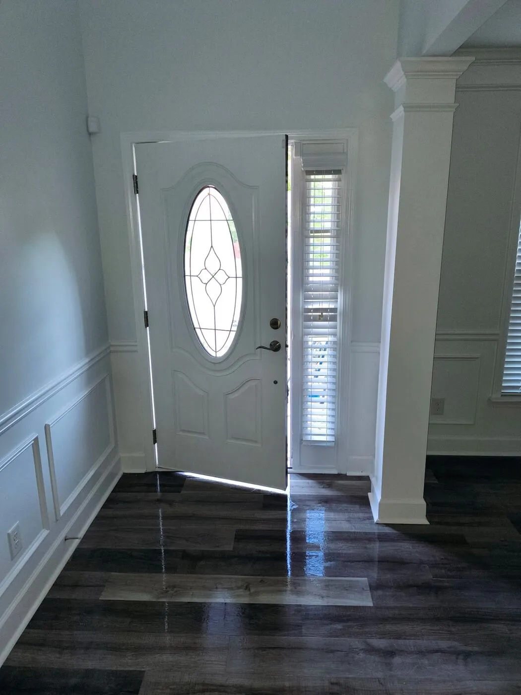 Entry with new floors and wainscoting