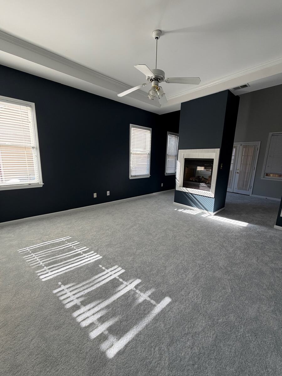 Living room repainted with navy accent walls