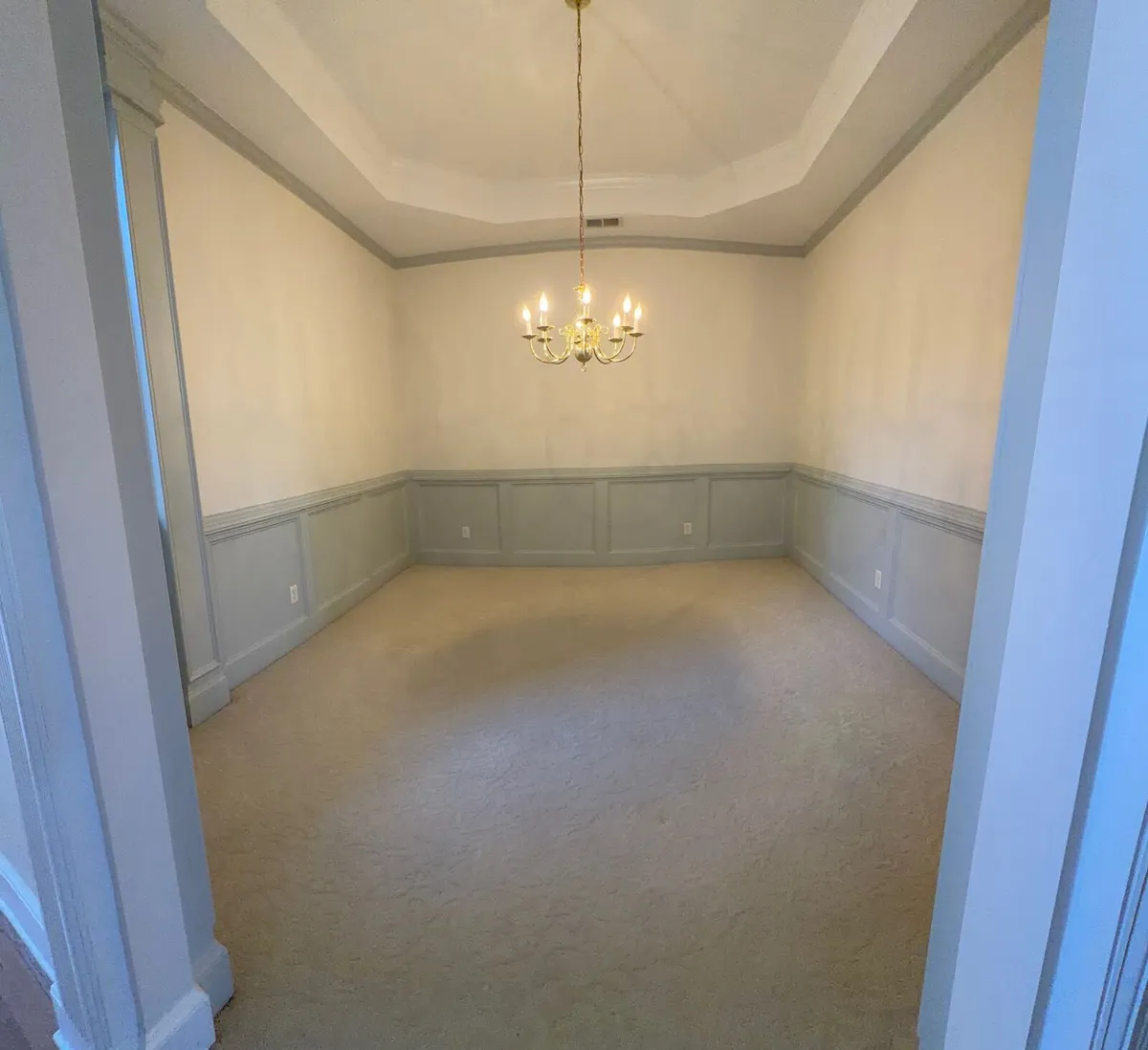 Dining room with fresh paint and wainscoting