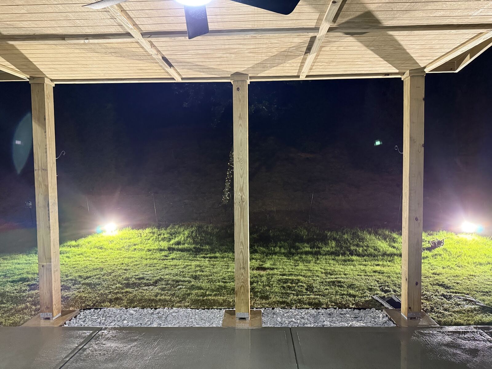 Looking out from under a new covered patio at night