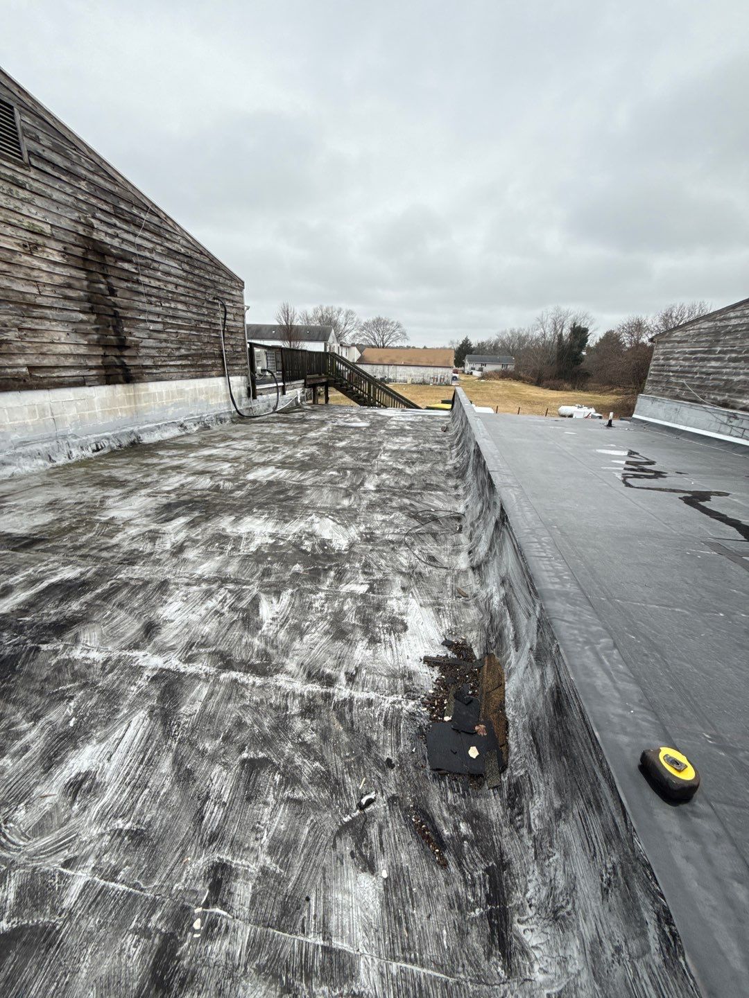 Peddlers Village Old Tattoo Shop Commercial Roof Inspection in Lewes, DE