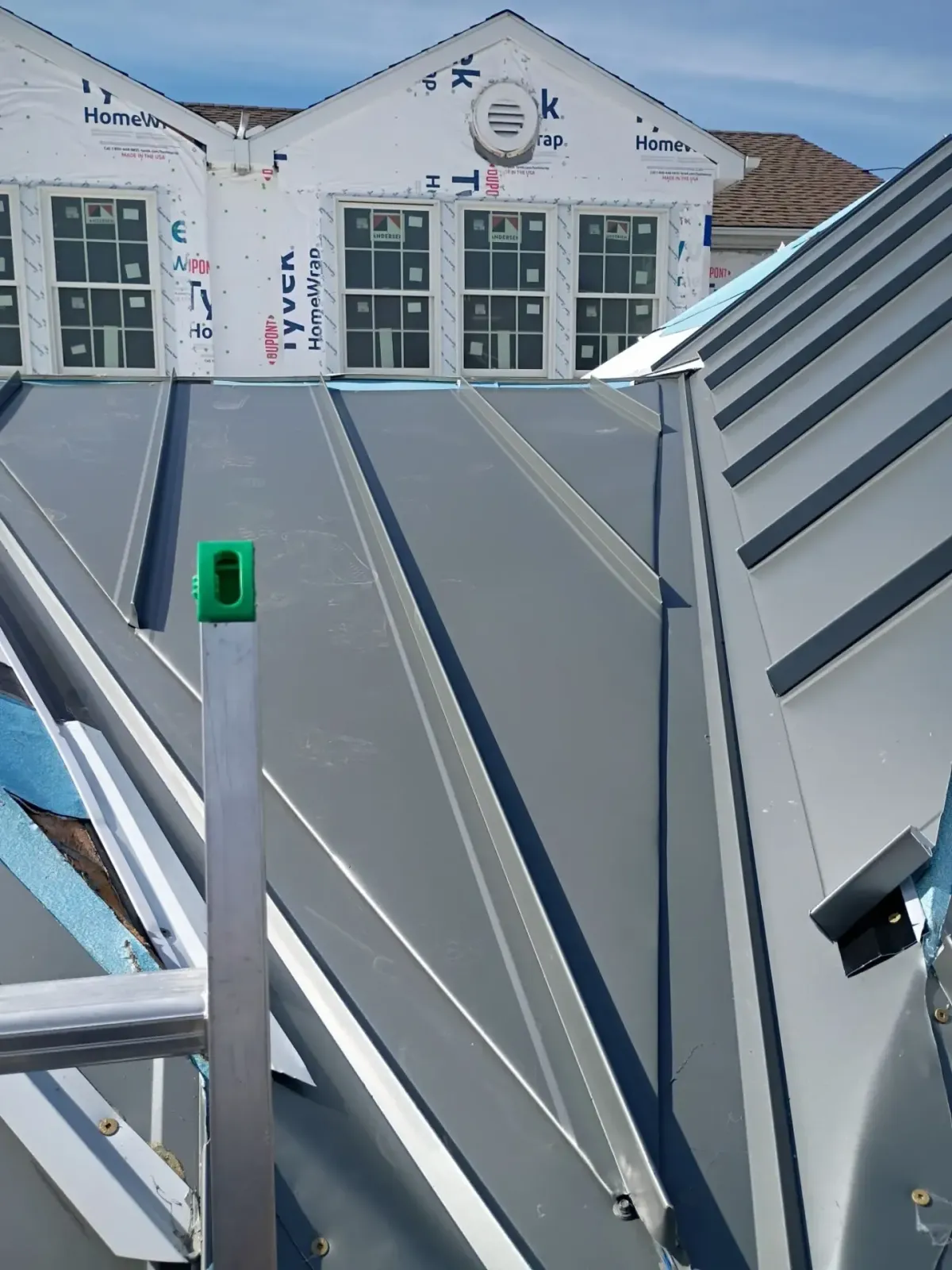 Standing-seam metal roofing installed on a residential property