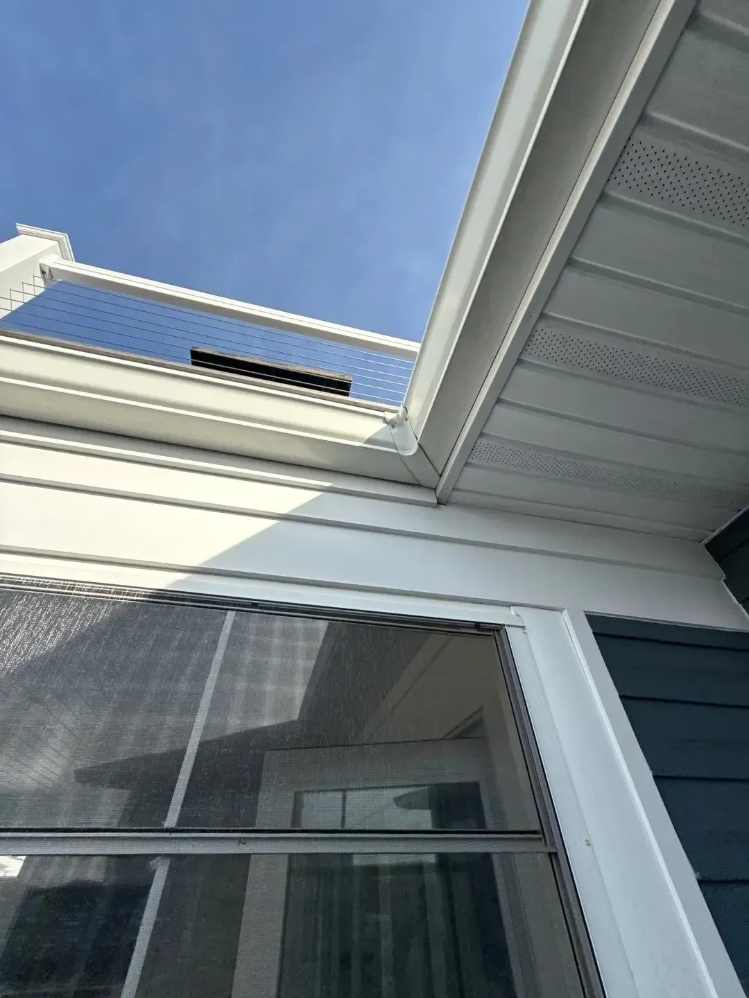 Close-up of a residential gutter and roof edge prepared for gutter guard installation