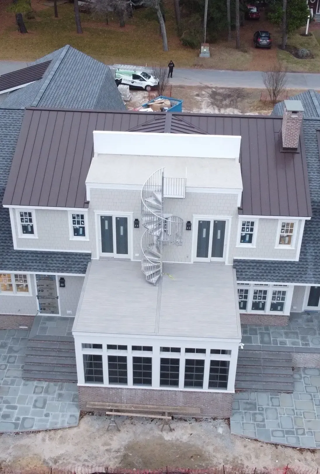 Aerial view of a coastal home with multiple exterior windows