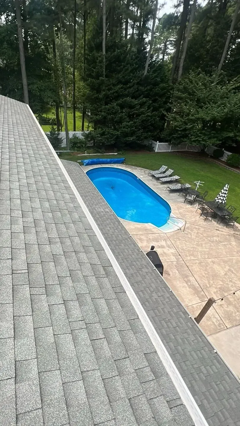 Gray asphalt-shingle roof overlooking a backyard pool at 200 Garden Street in Georgetown, Delaware.