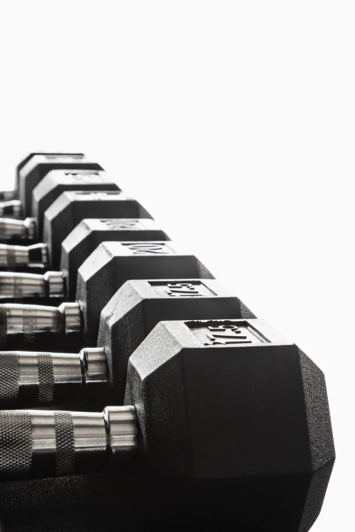 person holding black barbell