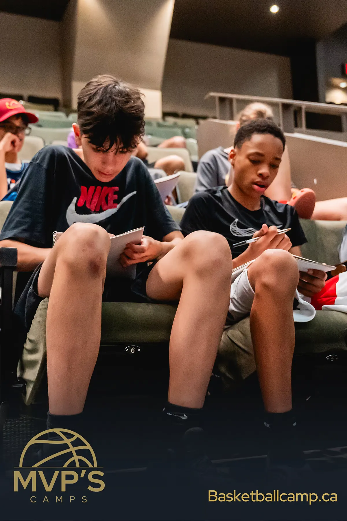 Advanced team training session developing championship-caliber basketball skills  Elite basketball players mastering team defensive strategies and formations  High-performance athletes executing complex offensive plays during intensive practice