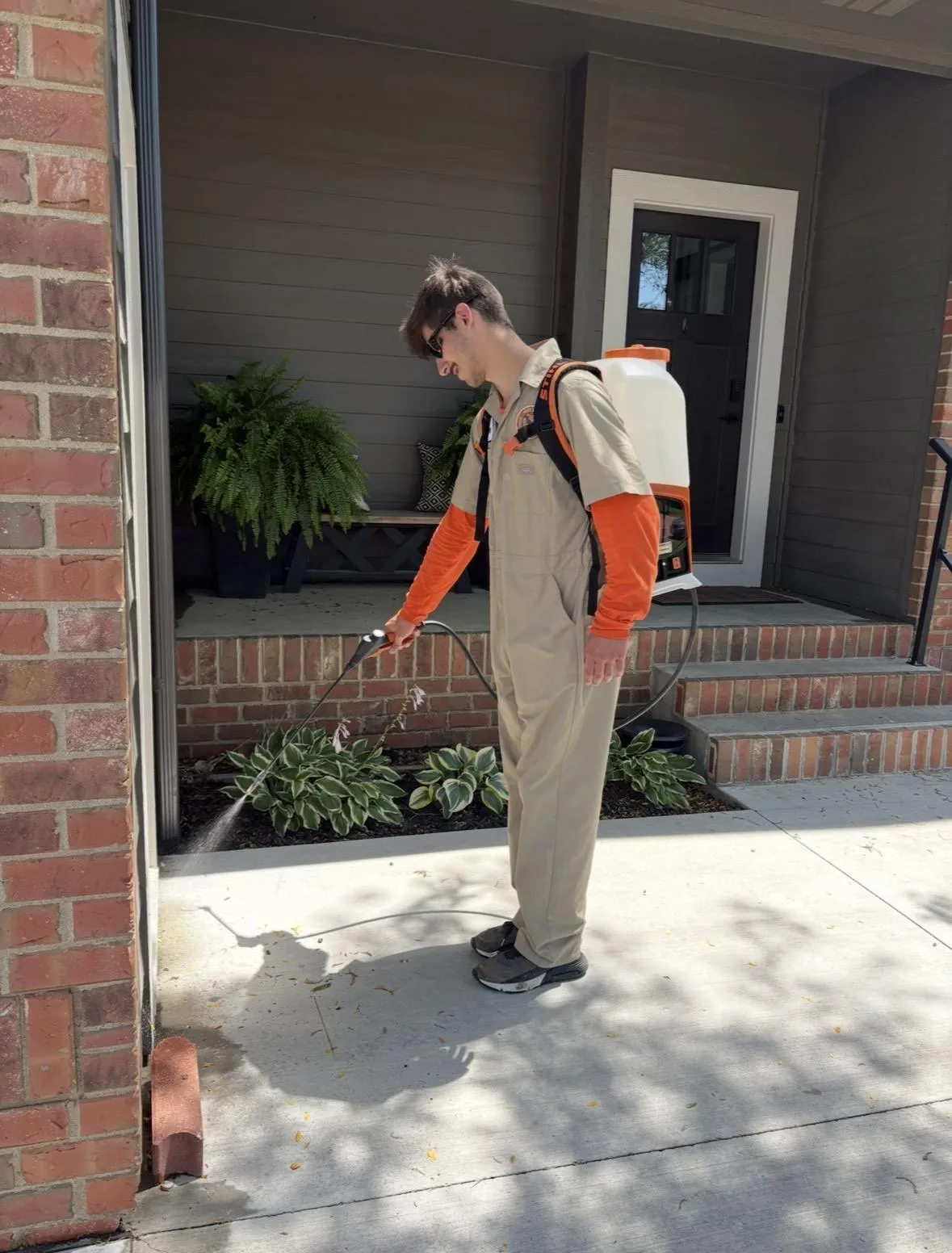 a living room filled with furniture and a kitchen
