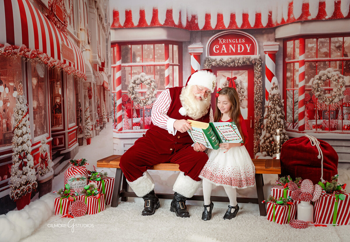 Santa interacting with a child during a mini session