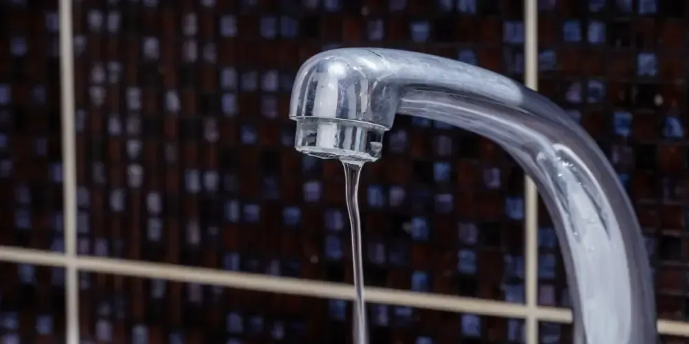 aucet with a weak stream indicating low water pressure.