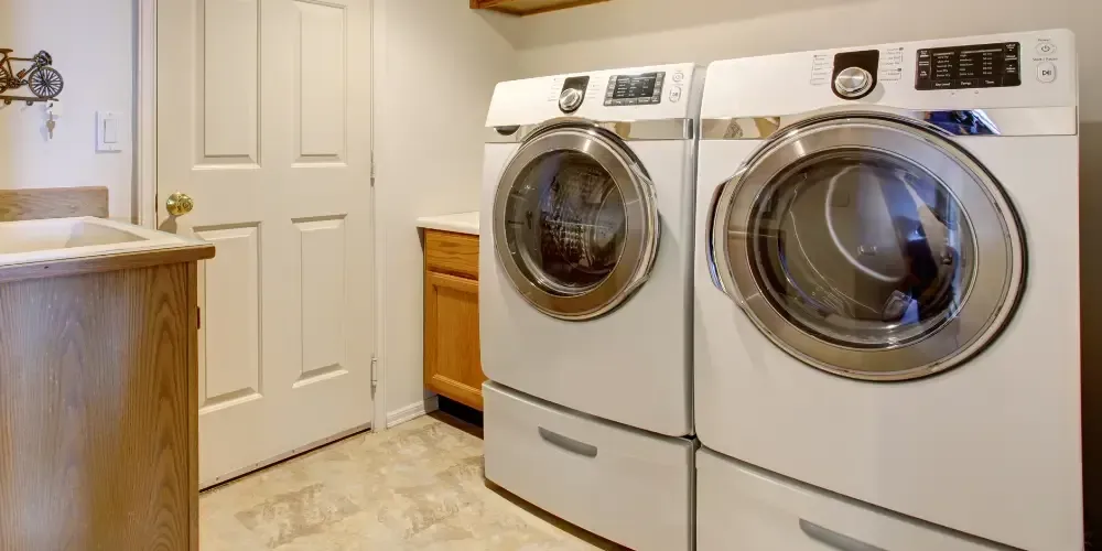 Washer and dryer installed in a residential laundry room.