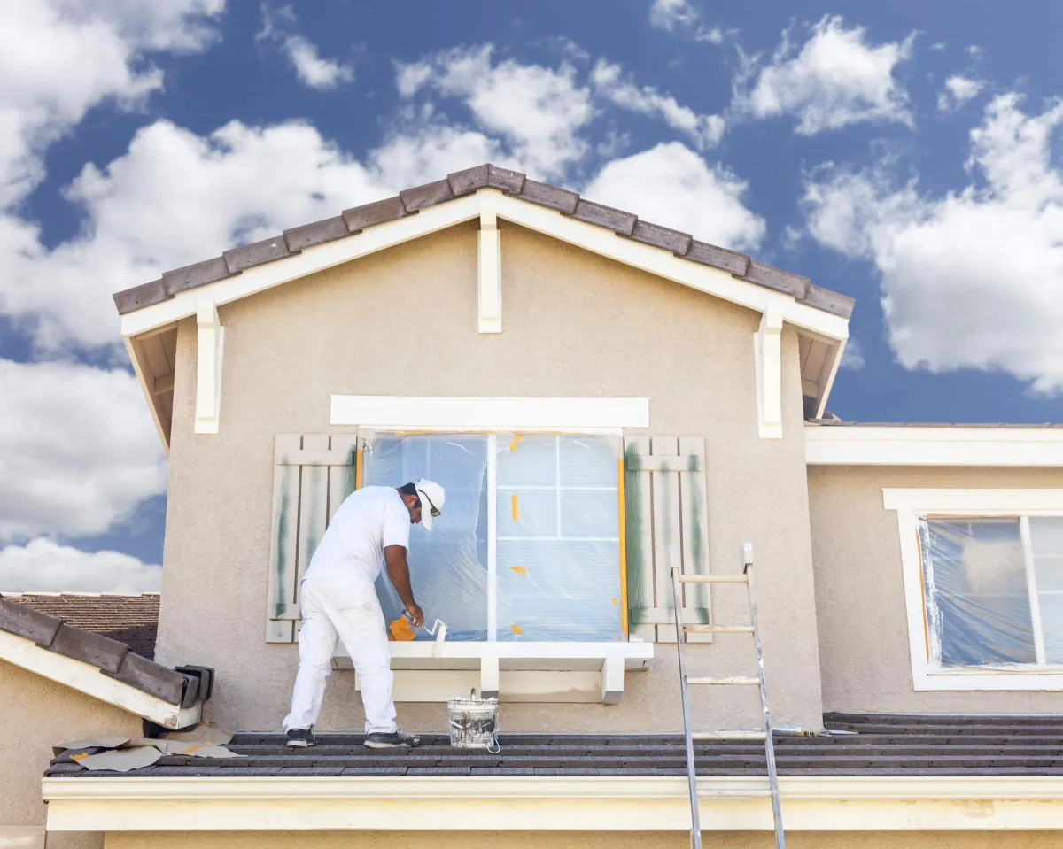 Man Painting House in Boca Raton 