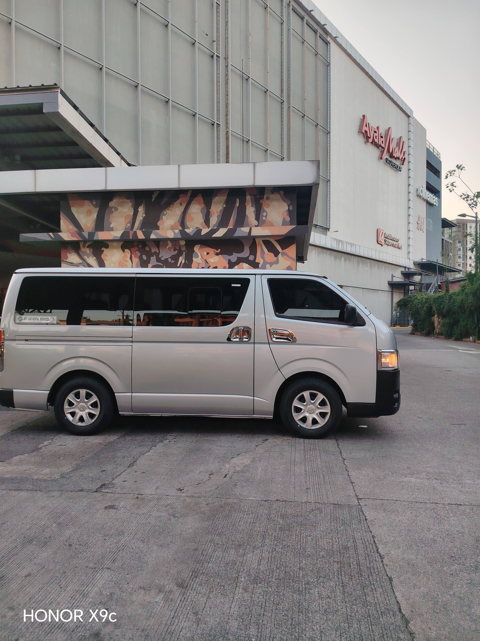 Van parked a shopping mall.