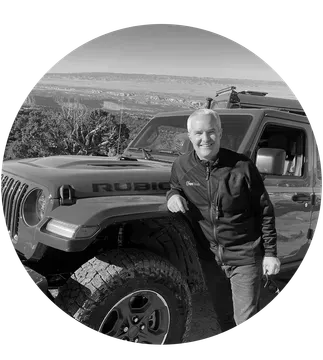 image of bryan robb standing next to jeep jt truck at moab ut