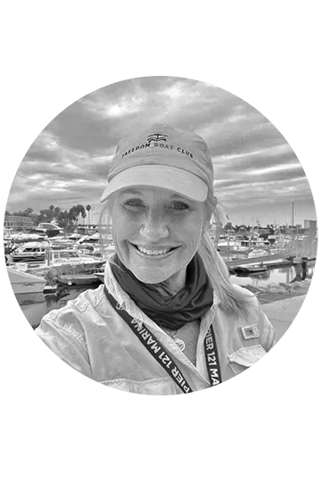 vicki norman image with background of marina to demonstrate marine industry expertise