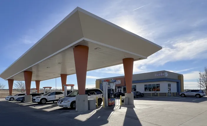 Apache Market 1 convenience store with fuel pumps, modern architecture, and clear signage, located in Lawton, Oklahoma, emphasizing fast service and accessibility.