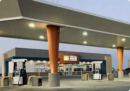 Apache Market 2 convenience store exterior with fuel pumps, featuring Fort Sill Apache branding, welcoming atmosphere for travelers along OK-9.