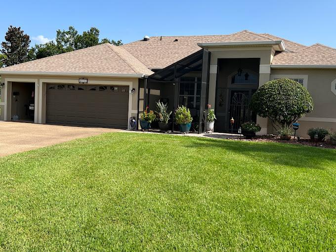 A house painted brown with cream accents.